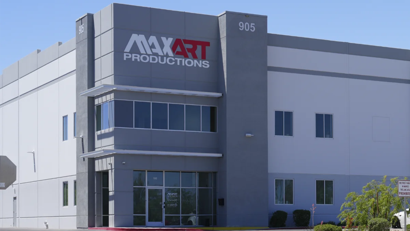 Facility exterior with Max Art signage, or a Las Vegas shipping-reach map