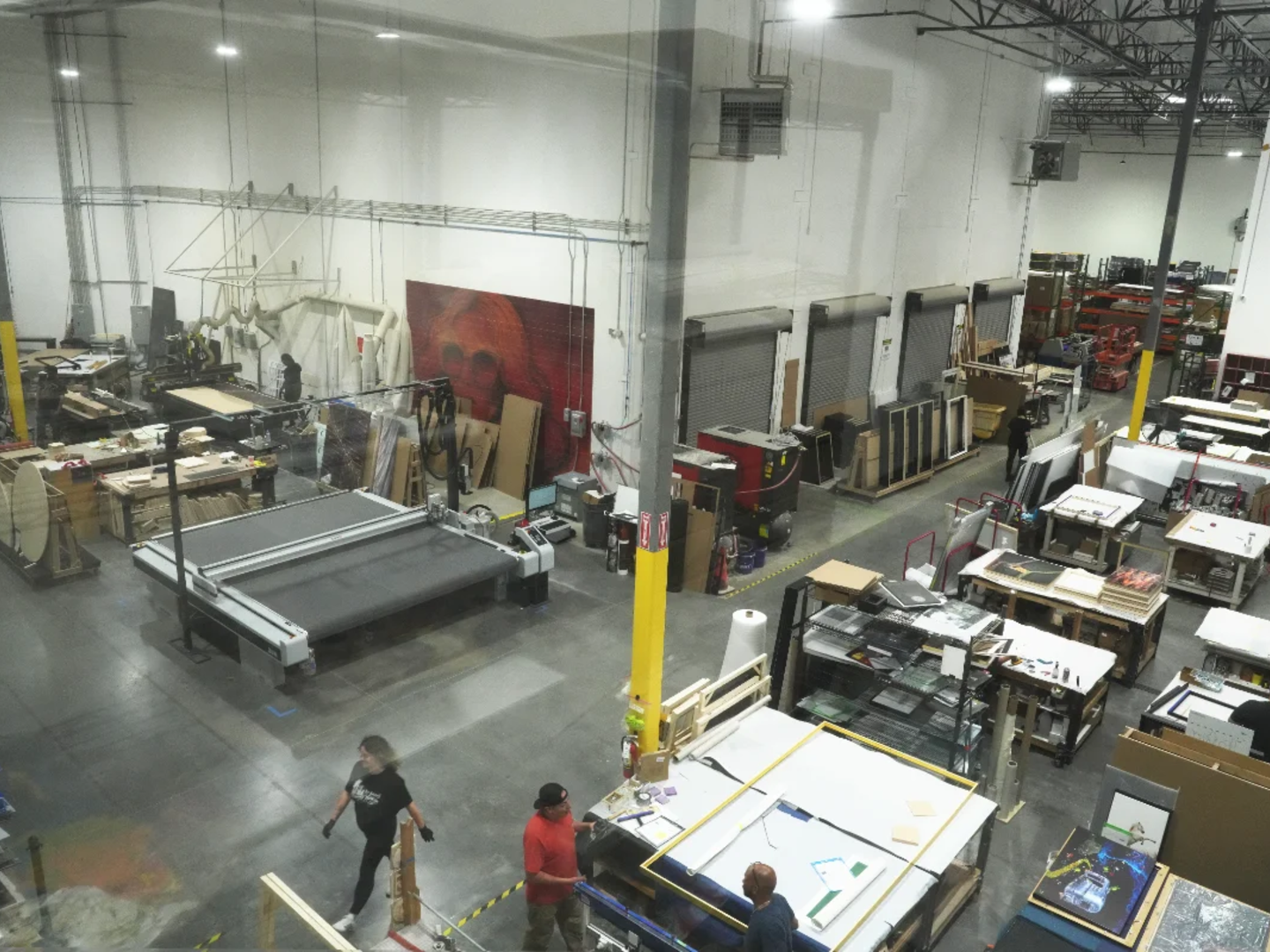 Production floor interior — 42,000 sq ft, people at work