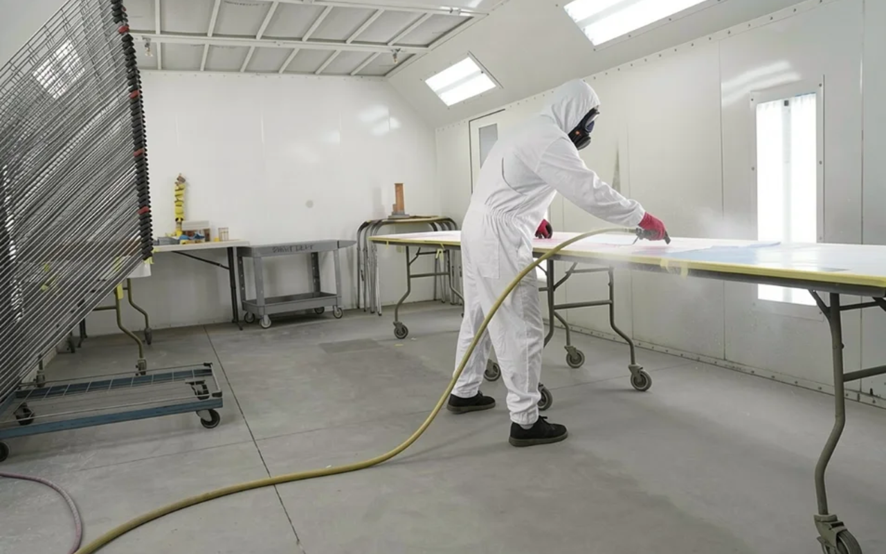 Spray booth interior with active paint work